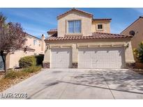 Two-story house with a two-car garage and desert landscaping at 256 Camino Viejo St, Henderson, NV 89012
