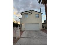 Two-story house with attached garage and driveway at 3923 Via Lucia Dr, Las Vegas, NV 89115