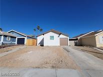Newly built single story home with a clean, modern design and attached garage at 7324 Empress Dr, Las Vegas, NV 89147