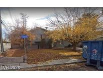 Exterior view of house with trees and street at 301 Lance Ave, North Las Vegas, NV 89030