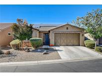 Single-story home with a two-car garage at 5653 Pleasant Palms St, North Las Vegas, NV 89081