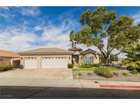 Single-story house with three car garage and landscaped yard at 1095 Endora Way, Boulder City, NV 89005