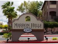 Community sign for Mission Hills Condominiums, showing the complex's name and address at 2305 W Horizon Ridge Pkwy # 3512, Henderson, NV 89052