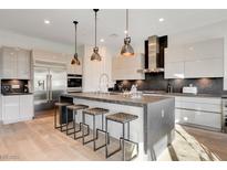 Modern kitchen with stainless steel appliances and island at 2567 Speyburn Ave, Henderson, NV 89044