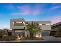 Modern two-story home with clean lines and landscaped front yard at 21 Canyon Bay Dr, Henderson, NV 89011