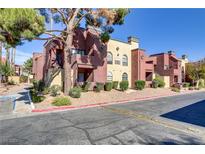 Attractive stucco building with landscaping and parking at 4050 Pacific Harbors Dr # 101, Las Vegas, NV 89121