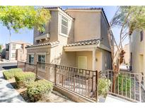 Two-story house with front yard landscaping and fence at 7733 Lively Loom Ct, Las Vegas, NV 89149