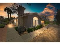 Attractive desert landscaping surrounds this single-story home with a covered entryway at 2259 Rugged Mesa Dr, Laughlin, NV 89029