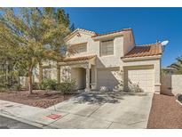 Two-story house with two car garage and desert landscaping at 2133 Desert Pines St, Las Vegas, NV 89134