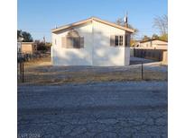 Single-wide manufactured home with gravel driveway at 280 Ferndell St, Pahrump, NV 89048