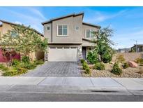 Two-story house with a gray facade, attached garage, and landscaped front yard at 312 Tembre Ct, Las Vegas, NV 89145