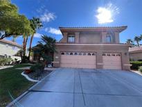 Two-story house with attached two-car garage and landscaped front yard at 2208 Fiero Dr, Las Vegas, NV 89134
