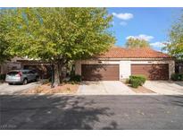 Front view of a two-unit building with double garages at 2484 Sabado St, Las Vegas, NV 89121