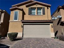 Two-story house with attached garage and landscaping at 6226 Buffalo Spring Ct, Las Vegas, NV 89122