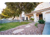 House exterior with manicured lawn and stone pathway at 564 Campus Oaks Ct, Las Vegas, NV 89183