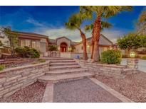 Landscaped front yard with stone pathway and stairs at 1950 Colvin Run Dr, Henderson, NV 89052