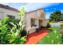 Spanish style home with a landscaped front yard at 7268 Drifting River Ct, Las Vegas, NV 89149