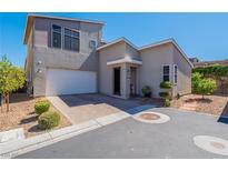 Modern house with attached garage and landscaping at 816 Stannard Ct, Henderson, NV 89052