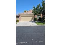 Single story home with attached garage and landscaping at 3445 Blue Ash Ln, Las Vegas, NV 89122
