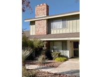 Attractive exterior of a house with brick chimney and well-maintained landscaping at 3004 El Camino Ave, Las Vegas, NV 89102