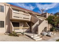 Tan two story apartment building with stairs and balconies at 3811 Desert Marina Dr # 126, Laughlin, NV 89029