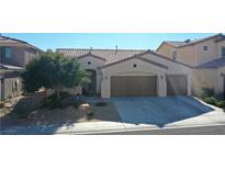 Two story house with double garage and landscaped yard at 1921 La Calera Ave, North Las Vegas, NV 89084