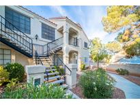 Two-story building with stairs and landscaping at 4724 Nara Vista Way # 204, Las Vegas, NV 89103