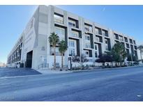 Upscale modern building exterior with palm trees and gated parking at 2715 W Pebble Rd # 505, Las Vegas, NV 89123