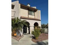 Two-story condo with arched entryway and desert landscaping at 5240 Janfred Ct # 1, Las Vegas, NV 89103