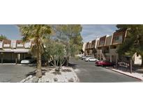 Exterior view of Boulder Hills apartment complex, featuring parking and landscaping at 1303 Darlene Way # 302A, Boulder City, NV 89005