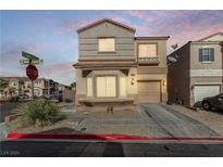 Two-story home exterior with attached garage at dusk at 10612 Golden Aspen Ct Ct, Las Vegas, NV 89129