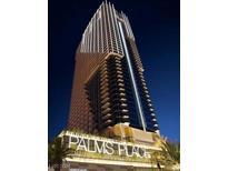 Exterior view of Palms Place high rise building at night at 4381 W Flamingo Rd # 3121, Las Vegas, NV 89103