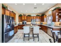 Gourmet kitchen featuring stainless steel appliances and granite countertops at 2247 Bannerwood St, Henderson, NV 89044