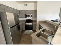 Modern kitchen featuring stainless steel appliances and granite countertops at 5415 W Harmon Ave # 1085, Las Vegas, NV 89103