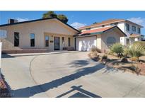 Ranch-style house with a single-car garage and curved driveway at 1008 Sproul Ct, Las Vegas, NV 89145