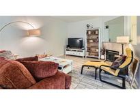 Cozy living room with fireplace and ample seating at 5250 S Rainbow Blvd # 1027, Las Vegas, NV 89118