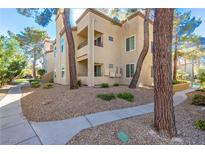 Attractive two-story condo building with landscaping and walkways at 3145 E Flamingo Rd # 2018, Las Vegas, NV 89121