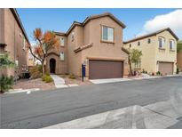 Two-story house with attached garage and landscaping at 8152 Satin Carnation Ln, Las Vegas, NV 89166