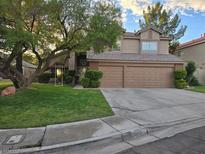 Two-story house with a three-car garage at 2065 Pinion Springs Dr, Henderson, NV 89074