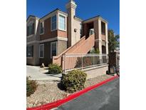 Well-maintained building exterior with gated entry at 1404 Seward St # 104, Las Vegas, NV 89128