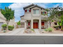 Two-story house with attached garage and landscaping at 6040 Sea Cliff Cove St, North Las Vegas, NV 89031
