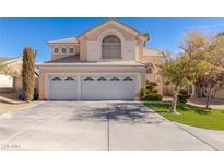 Two-story house with three-car garage and landscaping at 4702 San Palo Way, Las Vegas, NV 89147