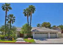 Single-story house with tile roof, three-car garage, and palm trees at 3767 Darren Thornton Way, Las Vegas, NV 89120