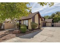 A-frame style home with attached garage and mature landscaping at 4571 Sirius Ave, Las Vegas, NV 89102