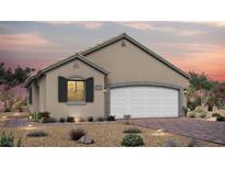 Single-story house with a two-car garage and desert landscaping at 104 Cadence Crest Ave, Henderson, NV 89011