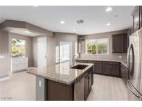 Modern kitchen with granite countertops and stainless steel appliances at 3000 Historic Horizon Ave, Henderson, NV 89044