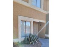 Tan two-story building exterior with entryway and agave plant at 3887 Terrazzo Ave, Las Vegas, NV 89115