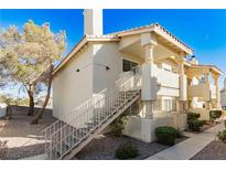 Updated condo exterior with stairs leading to private entrance at 933 Rockview Dr # 202, Las Vegas, NV 89128