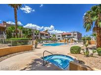 Community pool and spa with surrounding landscaping at 5162 S Jones Blvd # 105, Las Vegas, NV 89118