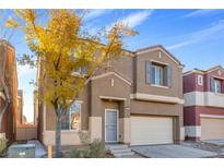 Two-story house with attached garage and landscaping at 9039 Last Hope Ave, Las Vegas, NV 89178